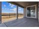 Covered patio showcases the yard and outdoor views, offering a relaxing outdoor space at 25214 E Warren Pl, Aurora, CO 80018