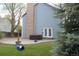 Private backyard featuring a patio, hot tub, and mature landscaping at 12381 E Vassar Dr, Aurora, CO 80014