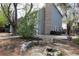 Landscaped backyard with a cozy fire pit area at 12381 E Vassar Dr, Aurora, CO 80014