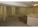 Finished basement with bar, neutral carpet, access to stairs and lots of potential living space at 12381 E Vassar Dr, Aurora, CO 80014