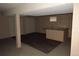 Finished basement features a bar area, wood-look vinyl flooring and neutral carpet at 12381 E Vassar Dr, Aurora, CO 80014