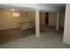 Spacious finished basement with bar area, carpeted and wood-look vinyl flooring, and neutral paint at 12381 E Vassar Dr, Aurora, CO 80014