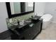 Bathroom with modern vessel sinks, granite countertop, and luxurious soaking tub at 12381 E Vassar Dr, Aurora, CO 80014