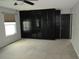 Spacious bedroom with large built-in closets, plush carpet and lots of space at 12381 E Vassar Dr, Aurora, CO 80014