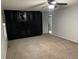 Spacious bedroom features a large built-in closet and plush carpet at 12381 E Vassar Dr, Aurora, CO 80014
