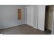 Neutral bedroom featuring carpet floors, a closet, a small shelf on the wall and natural light at 12381 E Vassar Dr, Aurora, CO 80014