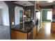 Kitchen with granite countertops, wine fridge, stainless steel appliances, and breakfast bar at 12381 E Vassar Dr, Aurora, CO 80014