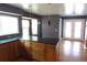 Spacious kitchen with granite countertops, custom wood cabinets, and pendant lighting at 12381 E Vassar Dr, Aurora, CO 80014