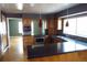Spacious kitchen with stainless steel appliances, granite countertops, and breakfast bar at 12381 E Vassar Dr, Aurora, CO 80014
