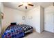 Comfortable bedroom offers neutral walls, carpeted floors, and a ceiling fan for a relaxing environment at 56607 E 23Rd Ave, Strasburg, CO 80136