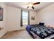 Cozy bedroom with soft carpet, ceiling fan, and window for natural light, creating a comfortable space at 56607 E 23Rd Ave, Strasburg, CO 80136