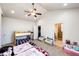 Well-lit bedroom features a bunk bed, ample closet space, and convenient access to an en-suite bathroom at 56607 E 23Rd Ave, Strasburg, CO 80136