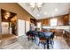 Spacious kitchen features tile floors, great natural light and is open to the living room at 56607 E 23Rd Ave, Strasburg, CO 80136