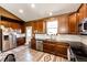 Spacious kitchen boasts stainless steel appliances, contrasting countertops, and ample cabinet space at 56607 E 23Rd Ave, Strasburg, CO 80136