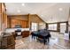 Open floor plan combining kitchen, dining area, and living room with large windows for natural light at 56607 E 23Rd Ave, Strasburg, CO 80136