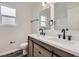 Modern bathroom featuring double vanity, quartz countertops, and updated fixtures at 19033 E 22Nd Cir, Aurora, CO 80011