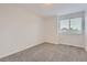 Neutral bedroom featuring plush carpet and window with natural light at 19033 E 22Nd Cir, Aurora, CO 80011