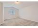 Bright bedroom featuring neutral carpet, window, and fresh paint at 19033 E 22Nd Cir, Aurora, CO 80011