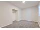 Neutral bedroom featuring plush carpet, closet, and freshly painted walls at 19033 E 22Nd Cir, Aurora, CO 80011
