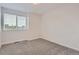 Neutral bedroom featuring plush carpet and window with natural light at 19033 E 22Nd Cir, Aurora, CO 80011