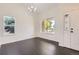 Bright dining room featuring wood floors and natural light from multiple windows at 19033 E 22Nd Cir, Aurora, CO 80011
