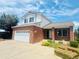 Charming two-story home with brick accents, a two-car garage, and newly installed grass at 19033 E 22Nd Cir, Aurora, CO 80011