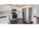 Modern kitchen featuring stainless steel appliances and white cabinets at 19033 E 22Nd Cir, Aurora, CO 80011