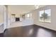 Open living room with hardwood floors, fireplace, and abundant natural light at 19033 E 22Nd Cir, Aurora, CO 80011