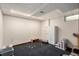 Finished basement area with carpet and storage shelves at 3411 S Olathe Way, Aurora, CO 80013