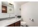 Bright bathroom featuring a gray countertop and white walls at 3411 S Olathe Way, Aurora, CO 80013