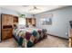 The bedroom is well-lit with light blue walls and a built-in headboard at 3411 S Olathe Way, Aurora, CO 80013