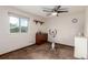 This bedroom features a window, ceiling fan, and an exercise bike at 3411 S Olathe Way, Aurora, CO 80013