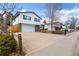 Charming two-story home features an attached garage, lovely landscaping, and great curb appeal at 3411 S Olathe Way, Aurora, CO 80013