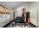 Inviting living space with a cozy seating area and staircase visible in background at 3411 S Olathe Way, Aurora, CO 80013