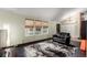 Comfortable seating area featuring bright light, a modern rug, and a cozy atmosphere at 3411 S Olathe Way, Aurora, CO 80013