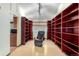 Inviting office space with custom cherry wood shelving and a large executive chair at 3411 S Olathe Way, Aurora, CO 80013