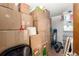 Walk in closet with storage, shelving, and cardboard boxes at 3411 S Olathe Way, Aurora, CO 80013