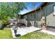 Relaxing backyard patio area with a wooden deck, outdoor seating, and lush greenery at 4321 Winona Ct, Denver, CO 80212