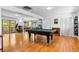 Entertainment room featuring a pool table, hardwood floors, and natural light from large windows at 4321 Winona Ct, Denver, CO 80212