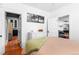 Comfortable bedroom showcases hardwood floors and a view into other rooms at 4321 Winona Ct, Denver, CO 80212