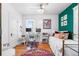 Bright bedroom with desk, a chair, a colorful rug, and ample natural light at 4321 Winona Ct, Denver, CO 80212