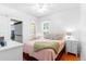 Cozy bedroom with a comfortable bed, bright windows, and ample natural light at 4321 Winona Ct, Denver, CO 80212