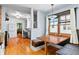 Cozy dining area with built-in bench seating and open view into the modern kitchen at 4321 Winona Ct, Denver, CO 80212