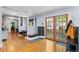 Charming dining area with hardwood floors, built-in bench seating, and French doors at 4321 Winona Ct, Denver, CO 80212