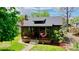 Charming home with a cozy front porch featuring a unique hanging chair at 4321 Winona Ct, Denver, CO 80212