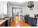 Modern kitchen featuring wood countertops, stainless steel appliances, and hardwood floors at 4321 Winona Ct, Denver, CO 80212