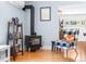 Comfortable living space featuring a wood-burning stove, hardwood floors, and cozy seating at 4321 Winona Ct, Denver, CO 80212