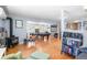 Relaxing living space with hardwood floors, fireplace, and seamless transition to entertainment area at 4321 Winona Ct, Denver, CO 80212