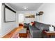 Comfortable living space with hardwood floors, sofa, and access to a bedroom and entertainment area at 4321 Winona Ct, Denver, CO 80212