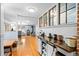 Bright open living space featuring wood floors and modern fixtures, perfect for entertaining at 4321 Winona Ct, Denver, CO 80212